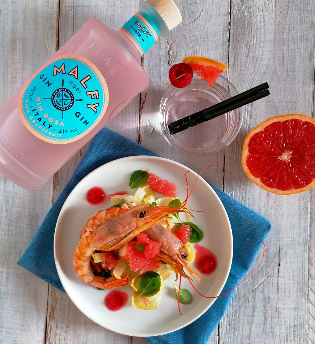 Gamberoni al pompelmo rosa e lamponi con gin Malfy